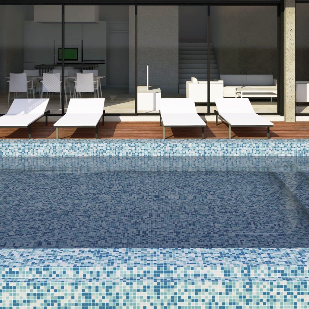 Paradise Fiji Glass Mosaic Pool Safe 300x300mm tiles lining a luxury swimming pool with white sun loungers and timber decking in a modern home setting.
