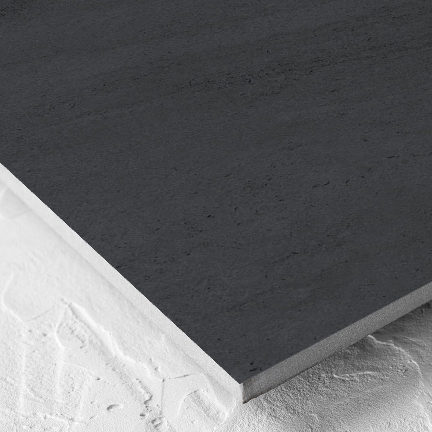 Corner close-up of the Paris Noir Matt 600x600mm tile showing the matt surface and the edge profile