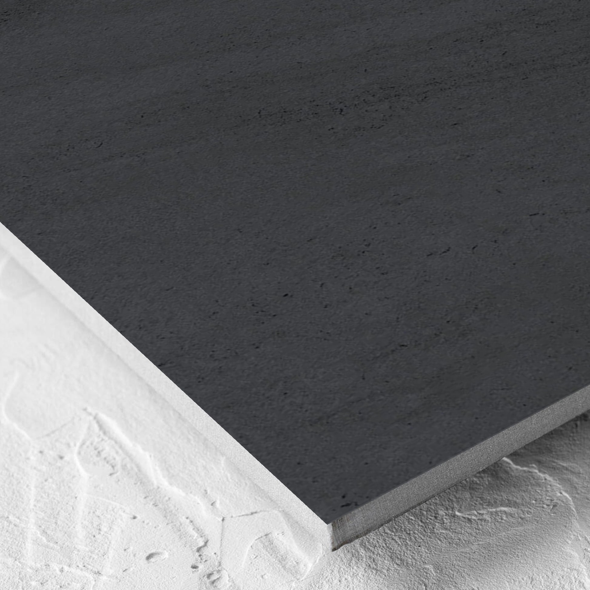 Corner close-up of the Paris Noir Matt 600x600mm tile showing the matt surface and the edge profile