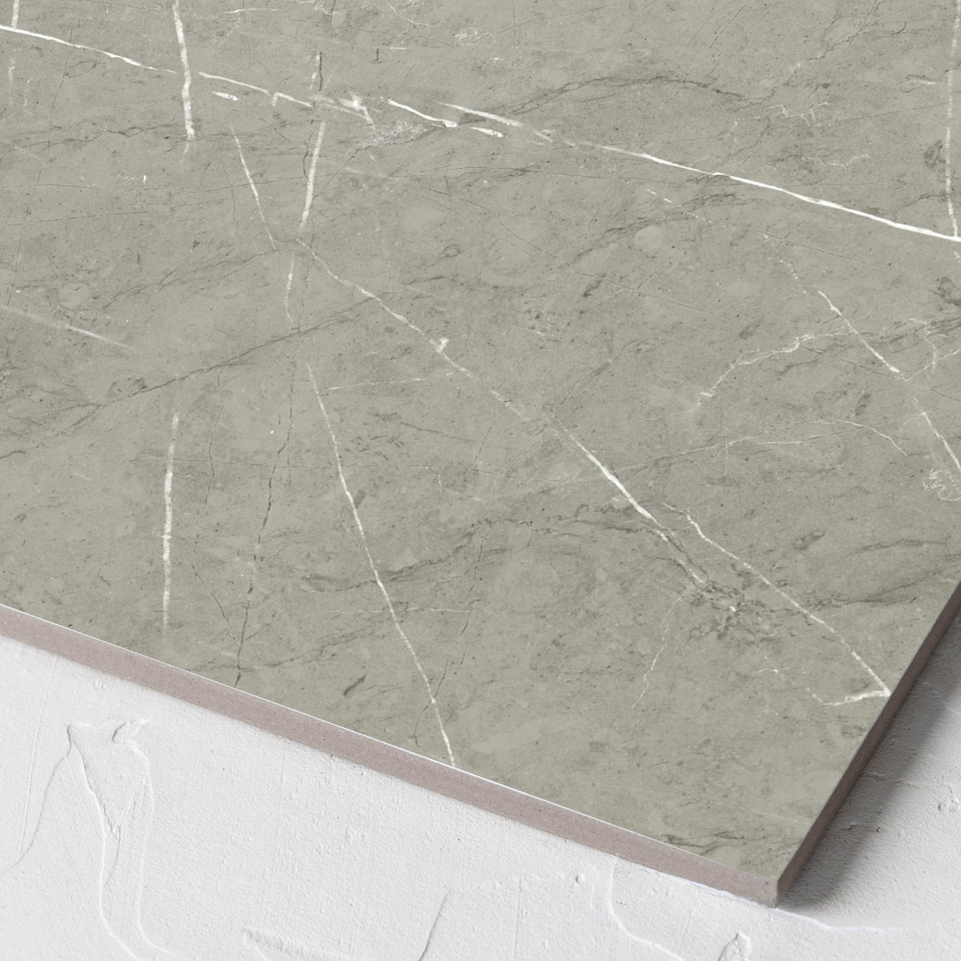 Corner close-up of the Pedra Light Grey Matt 300x300mm tile showing the matt surface and the edge profile