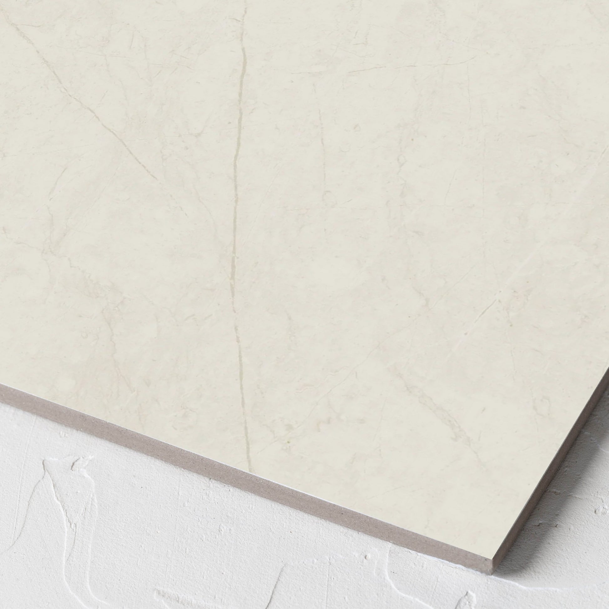 Corner close-up of the Pedra White Matt 300x300mm tile showing the matt surface and the edge profile