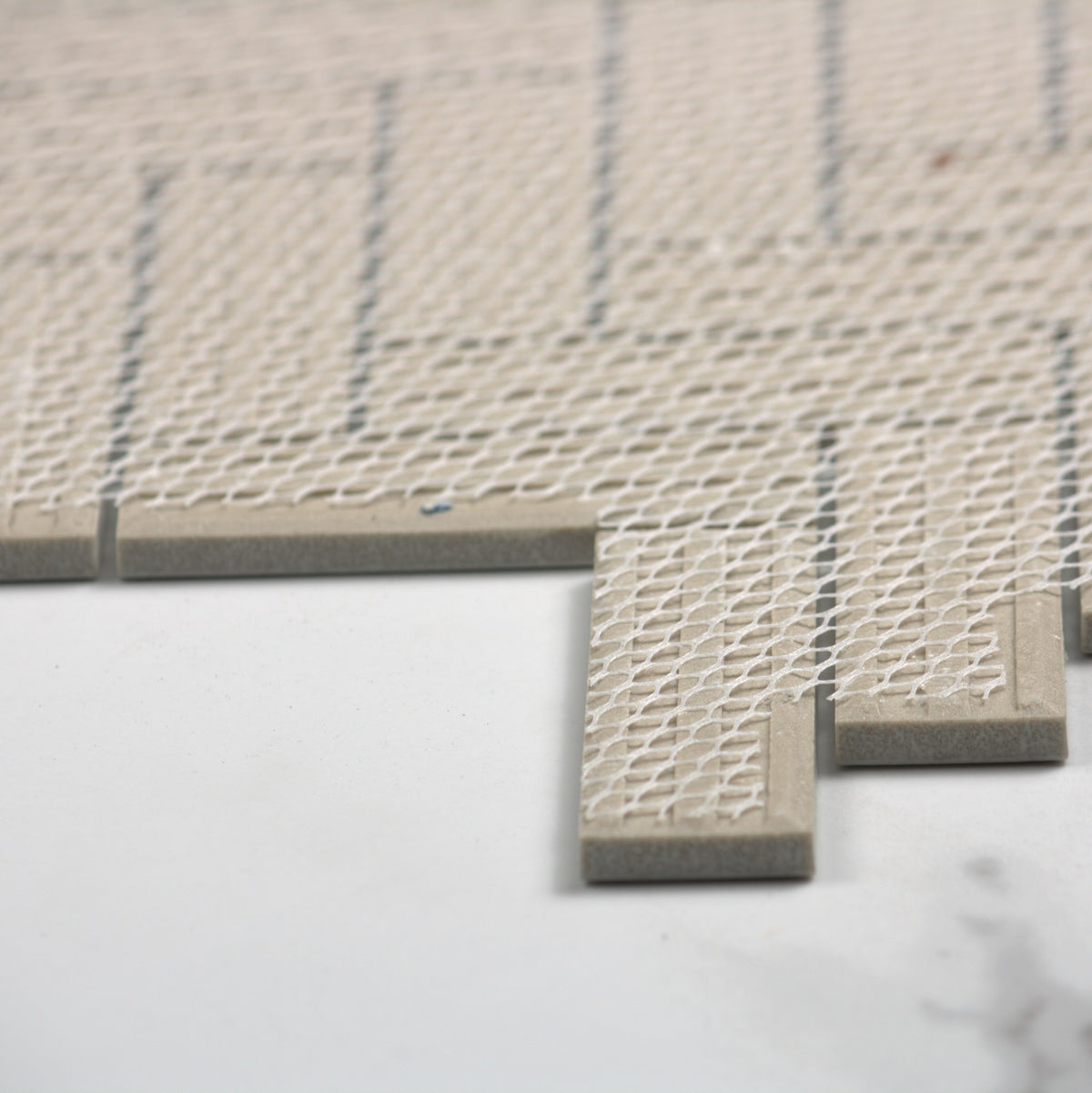 Carrara Look Matt Porcelain Glazed Herringbone Bond 23x73mm angle view