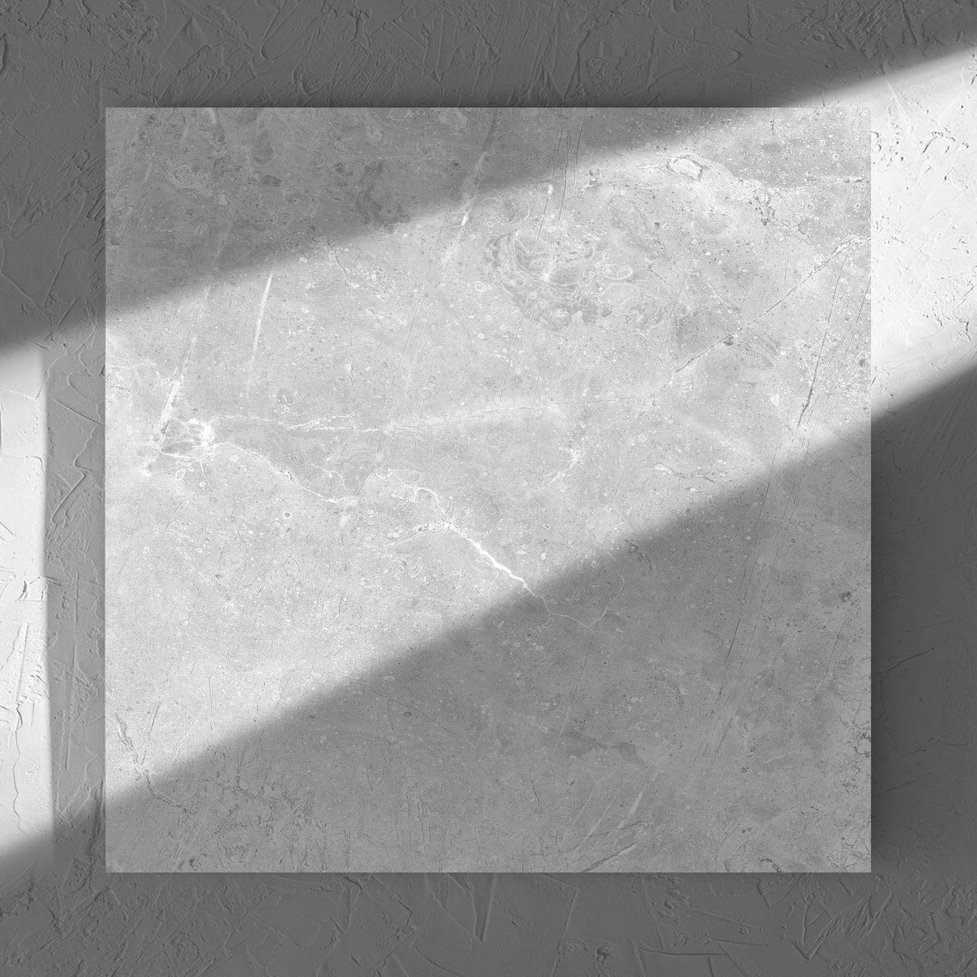 Potifino Oyster Matt 600x600mm tile in soft natural window light, showing the matt surface