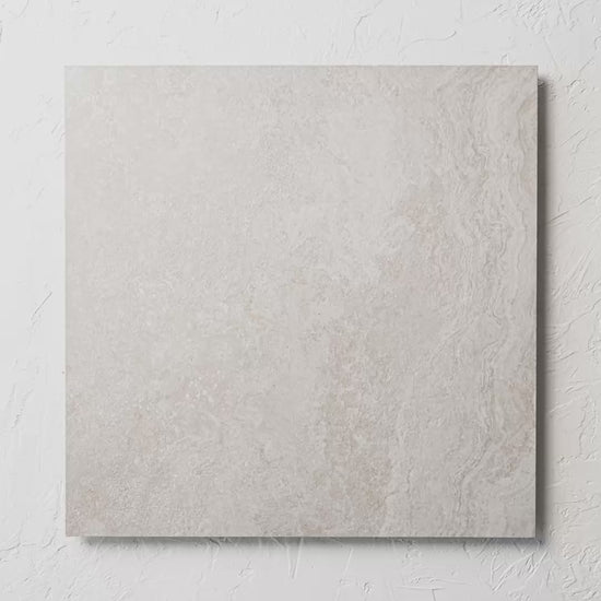 Norcia Travertine Silver External Rectified Paver 600X600X20Mm tile shown in hand