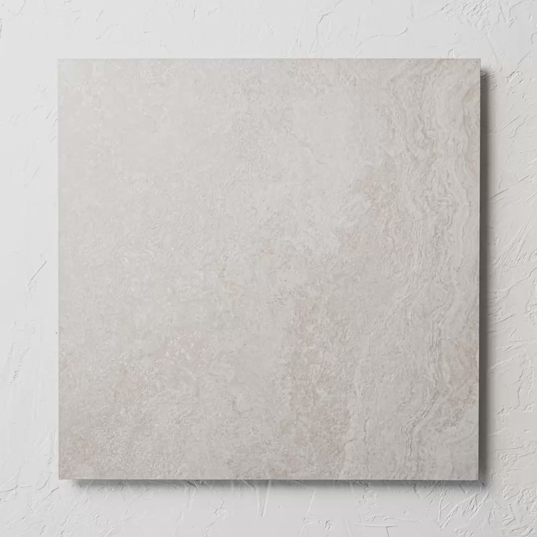 Norcia Travertine Silver External Rectified Paver 600X600X20Mm tile shown in hand