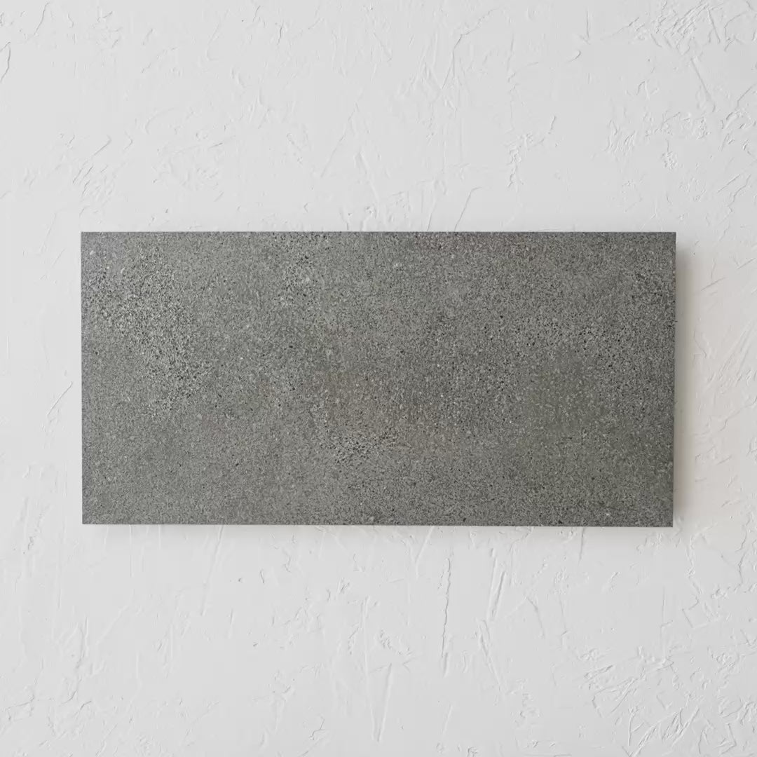 Oslo Charcoal Rectified 300X600Mm tile shown in hand