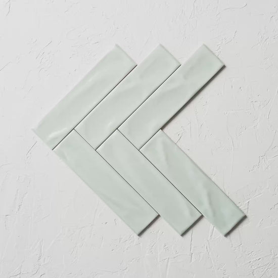 Pasha Sage Gloss 75X300Mm tile shown in hand