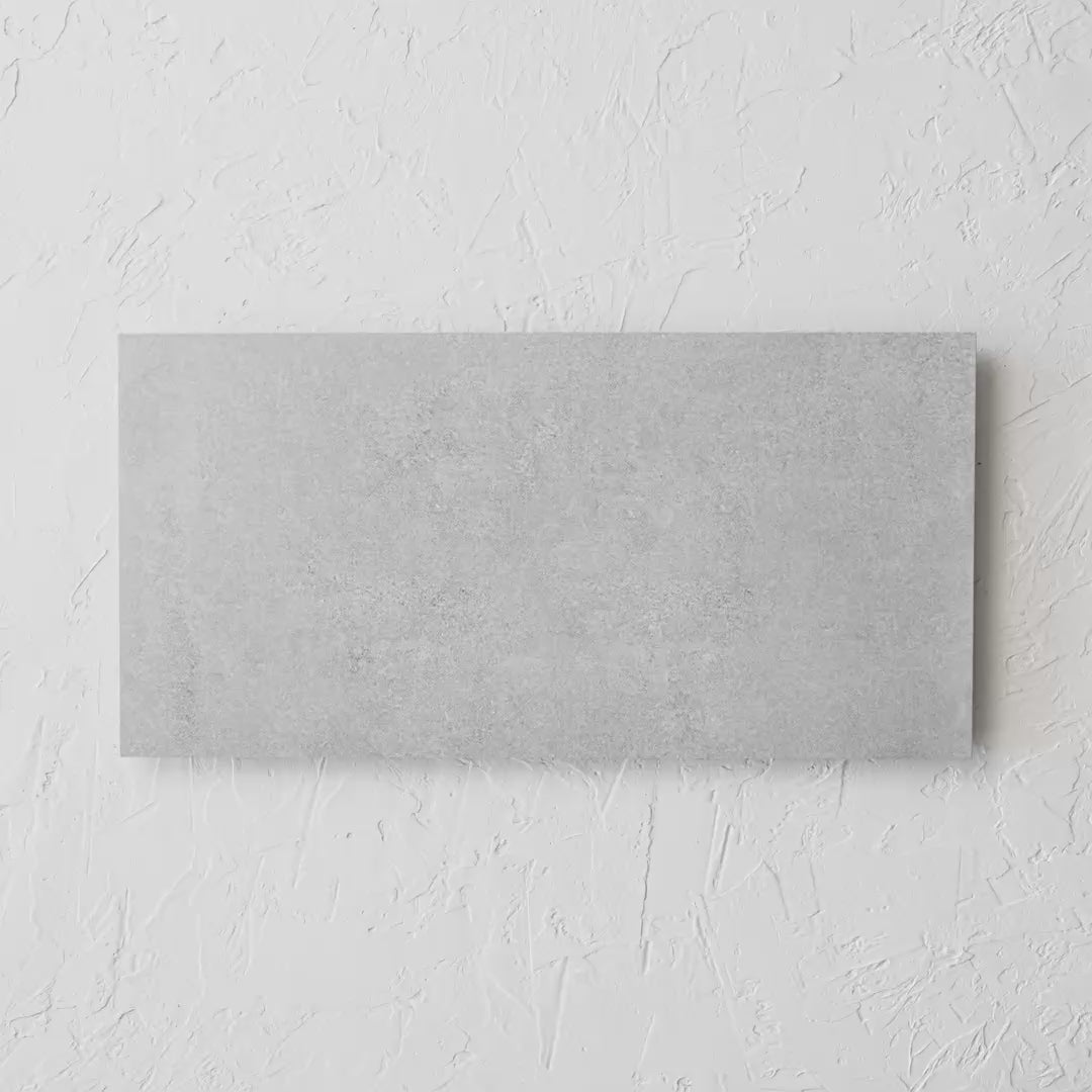 Boston Ivory Matt Rectifed 300X600Mm tile shown in hand