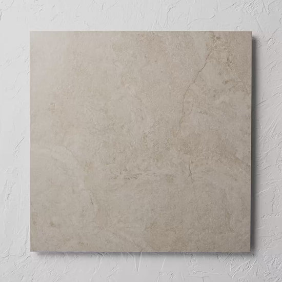 Paradise Stone Ivory Matte Rectified 600X600Mm tile shown in hand