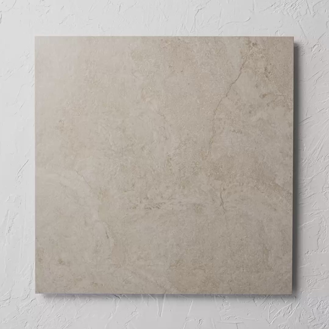 Paradise Stone Ivory Matte Rectified 600X600Mm tile shown in hand