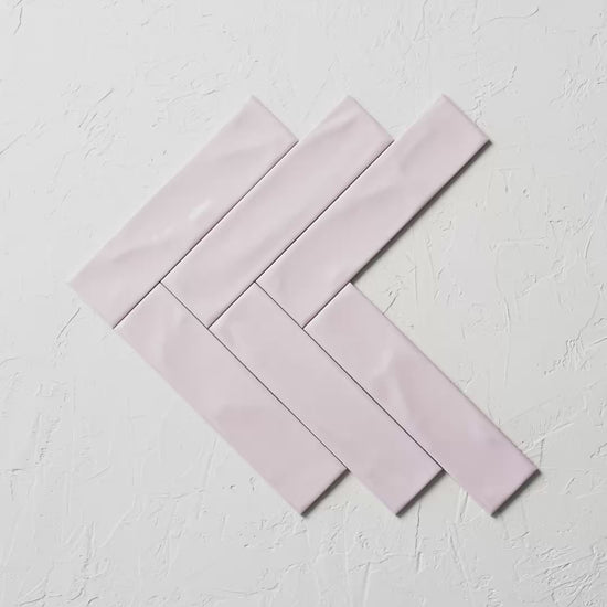 Pasha Rosewater Gloss 75X300Mm tile shown in hand