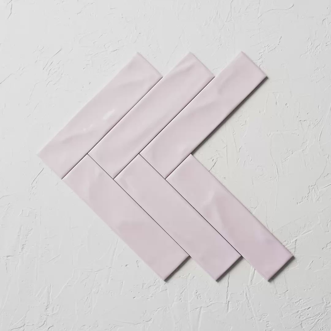 Pasha Rosewater Gloss 75X300Mm tile shown in hand