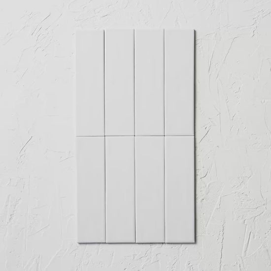 Brava White Satin 60X217Mm tile shown in hand