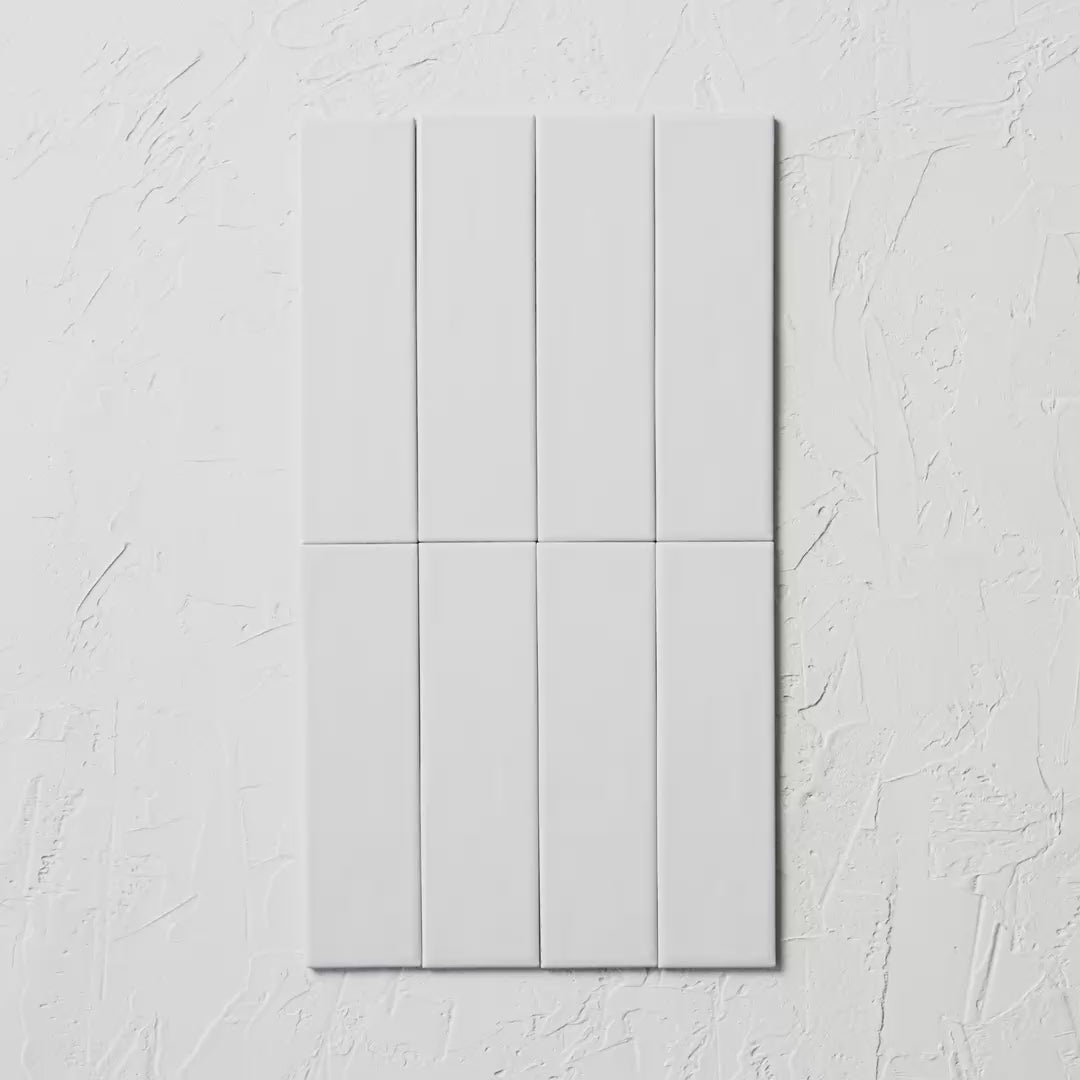 Brava White Satin 60X217Mm tile shown in hand