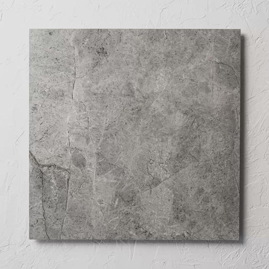 Riviera Dark Grey 600X600Mm tile shown in hand