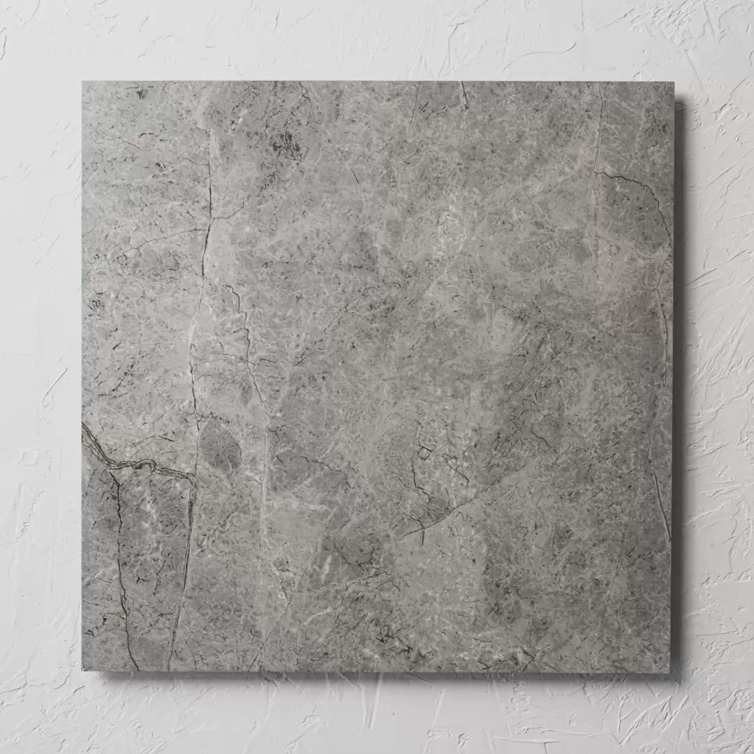 Riviera Dark Grey 600X600Mm tile shown in hand