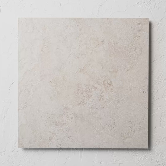 Norcia Travertine Beige External Rectified Paver 600X600X20Mm tile shown in hand