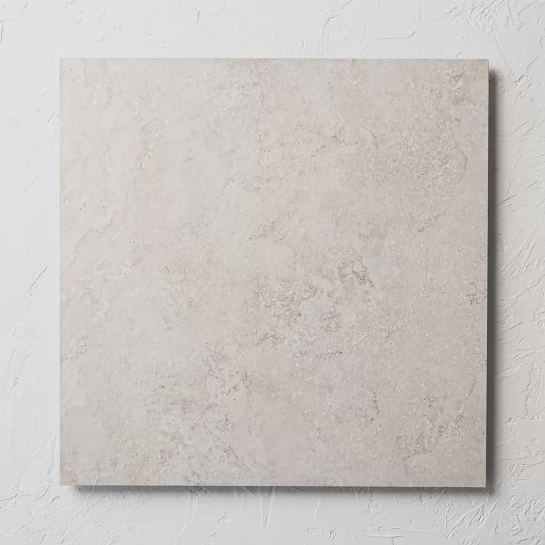 Norcia Travertine Beige External Rectified Paver 600X600X20Mm tile shown in hand