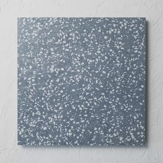 Vogue Blue Rectified 600X600Mm tile shown in hand