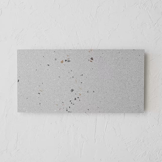 Vangogh Grey Matt Rectified 300X600Mm tile shown in hand
