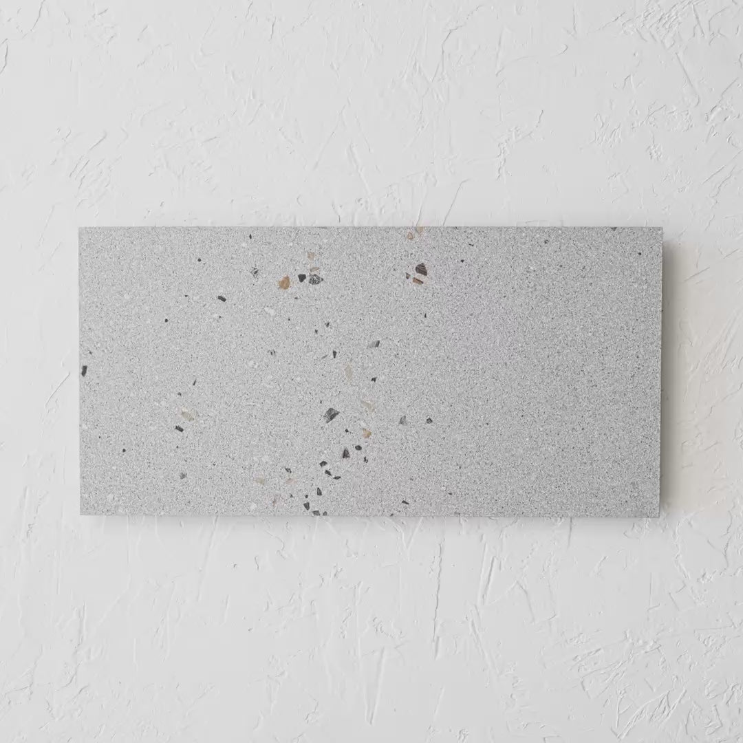 Vangogh Grey Matt Rectified 300X600Mm tile shown in hand