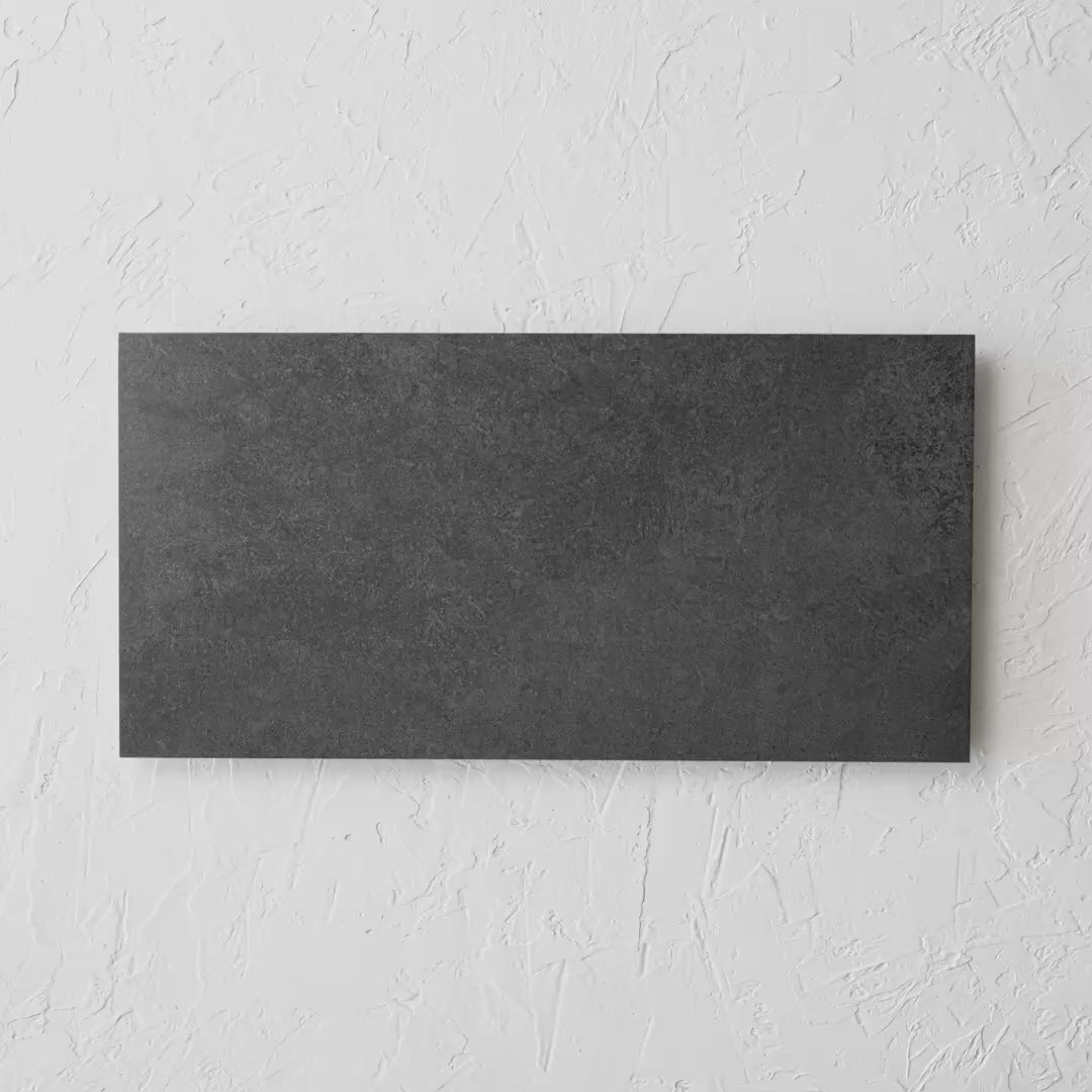Soho Carbon Rectified 300X600Mm tile shown in hand
