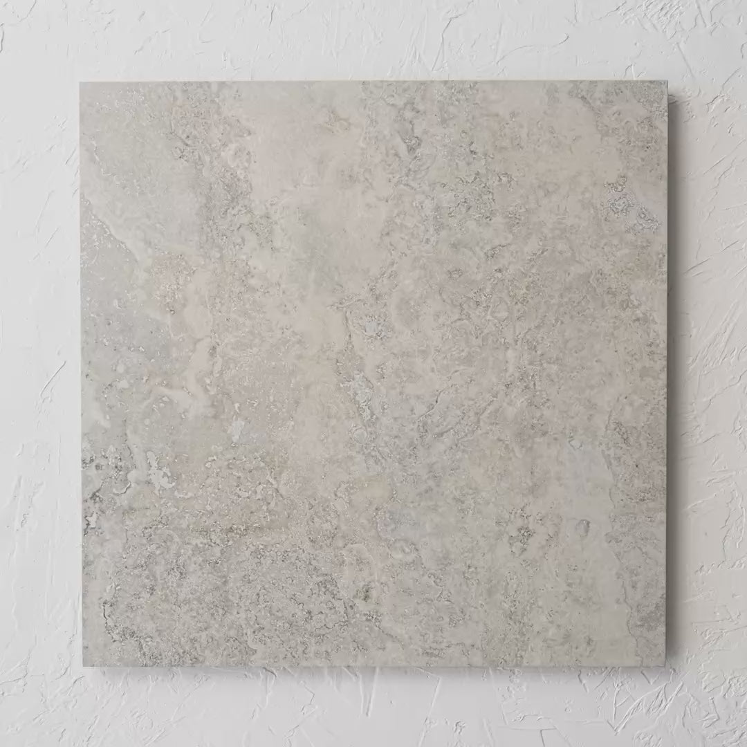 New Travertino Beige Matt Rectified 600X600Mm tile shown in hand