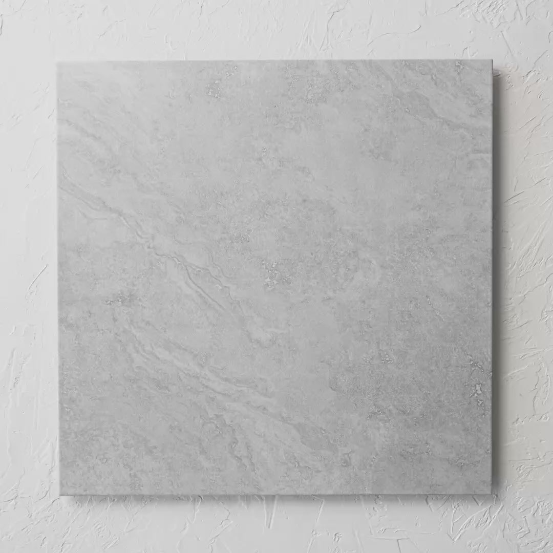 Eco Stone Grey Matt 600X600Mm tile shown in hand