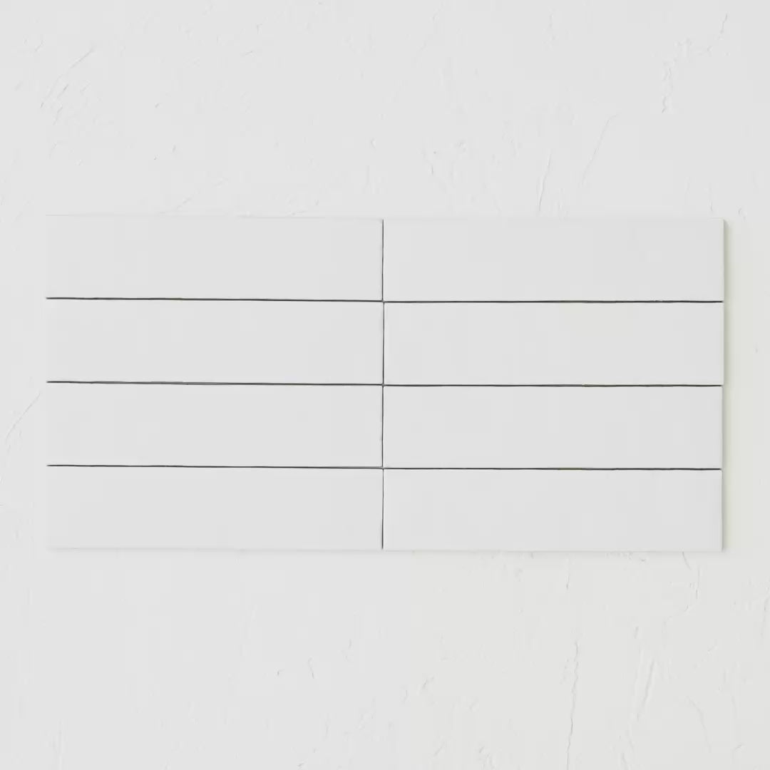 Bricks White Glossy Bricks White Glossy 60X246 tile shown in hand