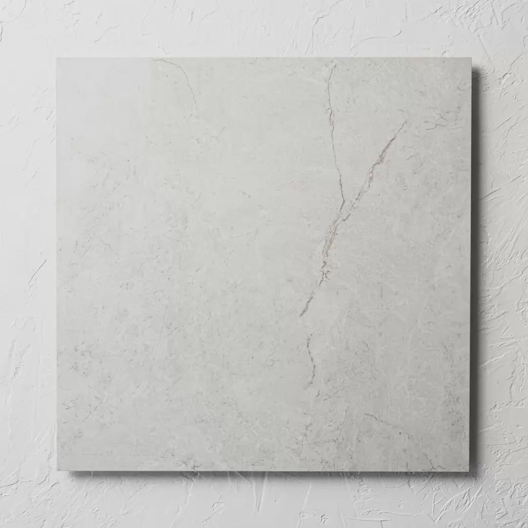 Riviera Light 600X600Mm tile shown in hand