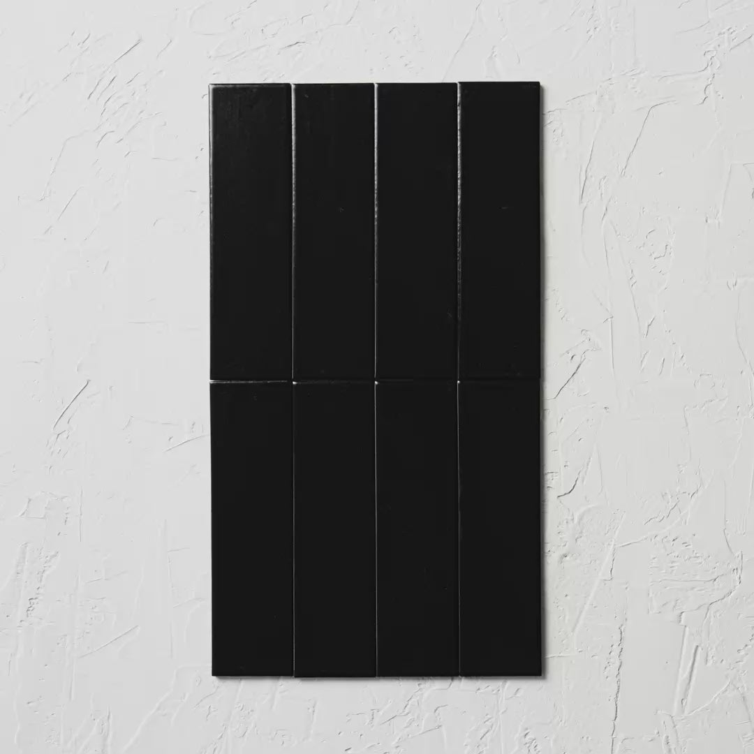 Brava Black Satin 60X217Mm tile shown in hand