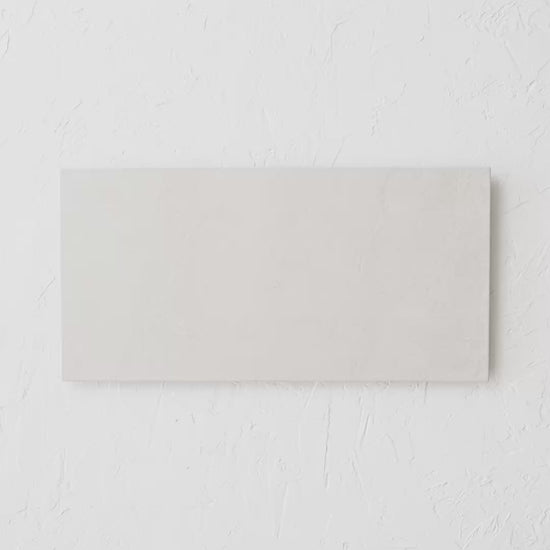 Dolomite Sand 300X600Mm tile shown in hand