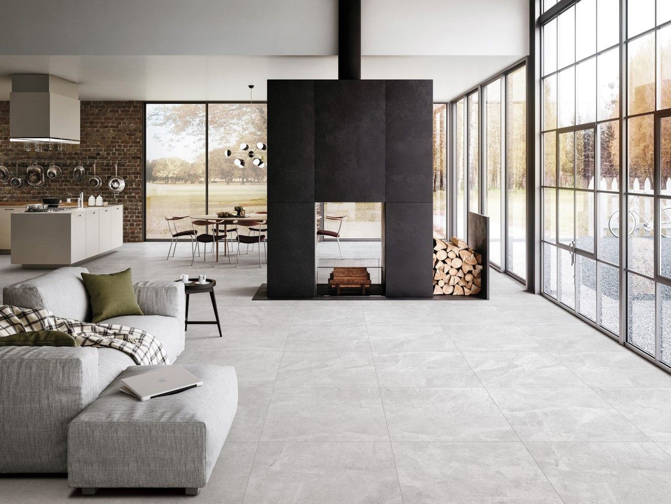 Riviera Grigio 600x600mm light grey porcelain floor tiles installed in a modern open-plan living room featuring a black suspended fireplace and floor-to-ceiling windows.