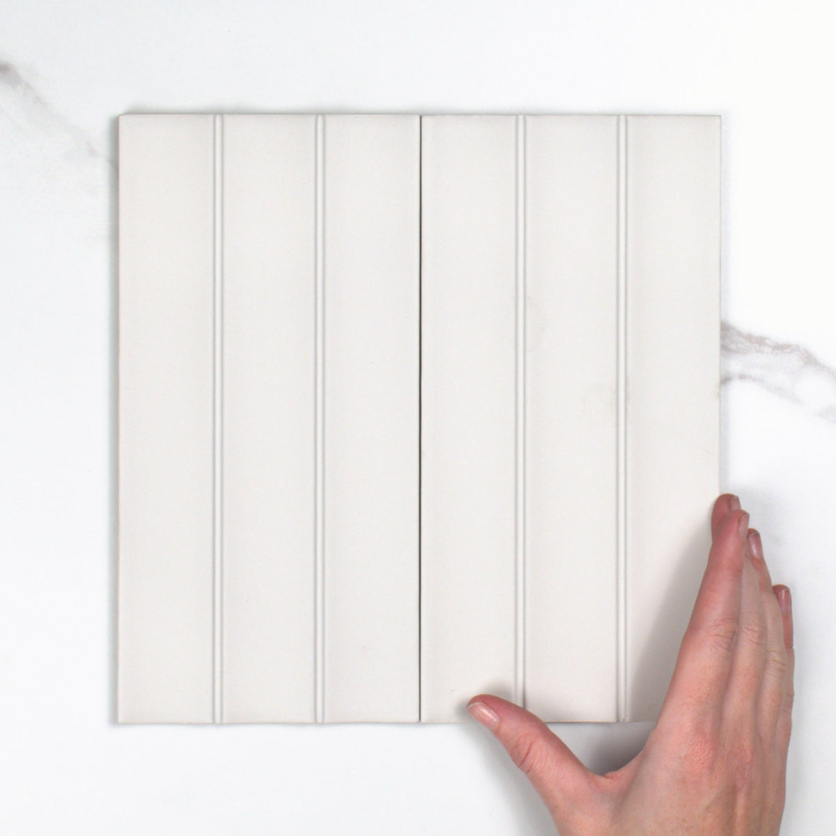 Scala Gesso Matt 115x231mm top view, hand for scale