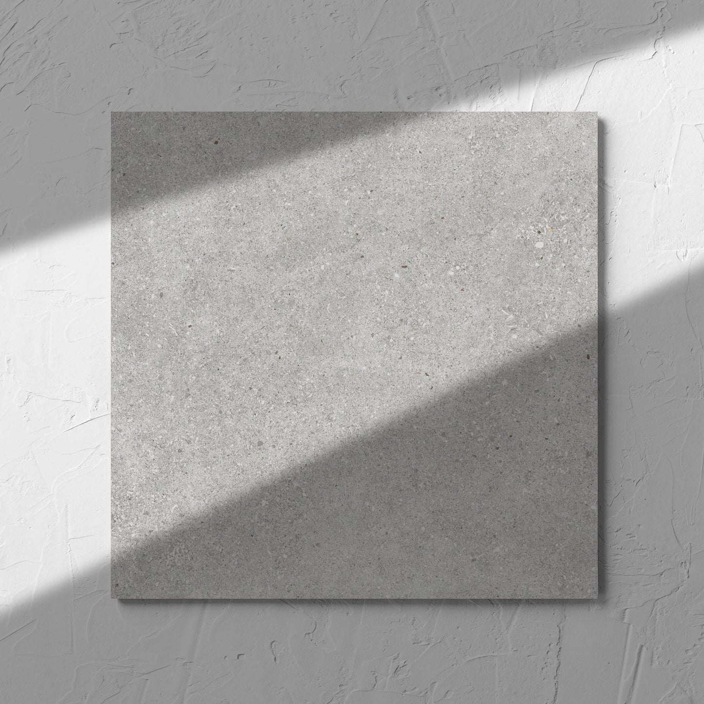 Serenity Concrete Grey 300x300mm tile in soft natural window light, showing the matt surface