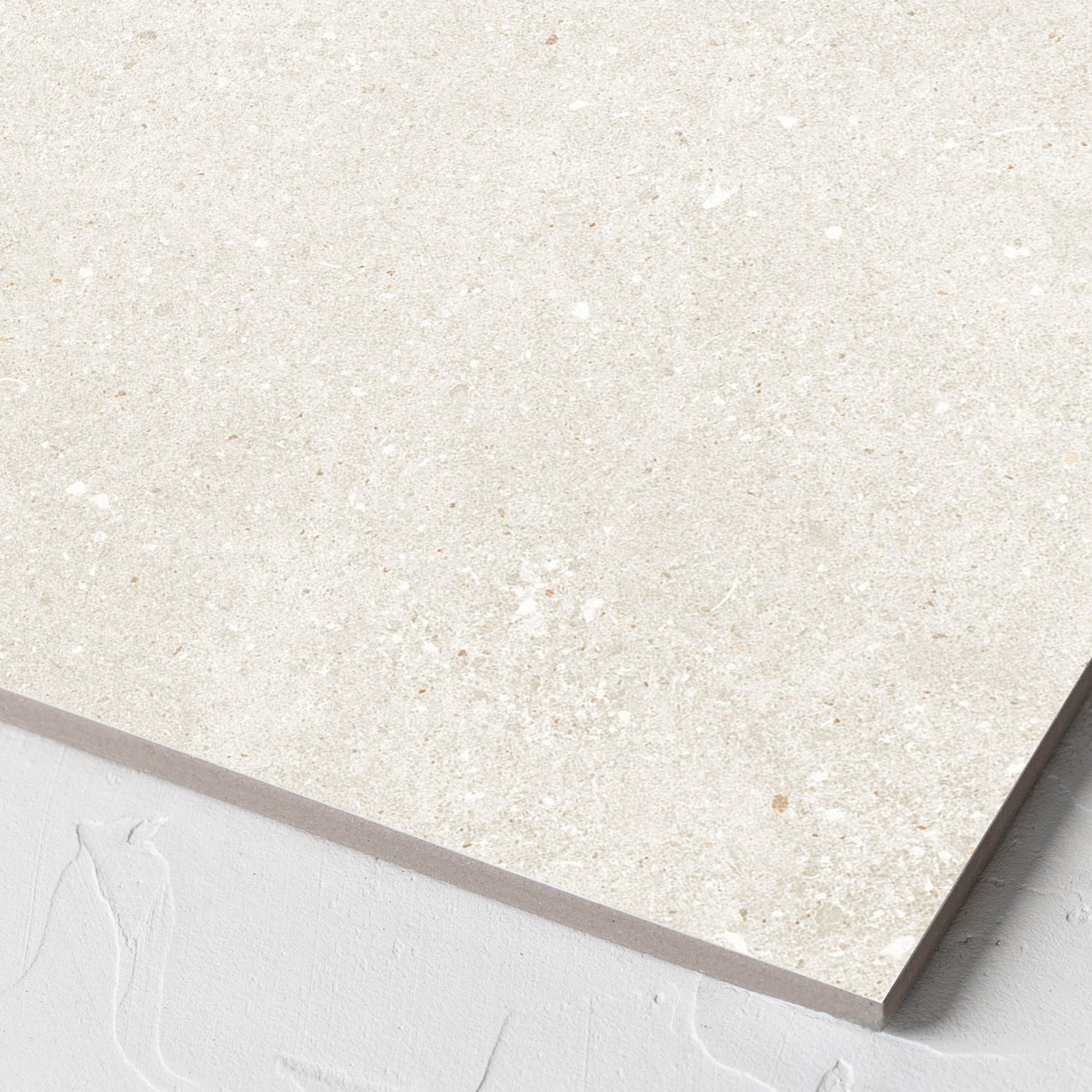 Corner close-up of the Serenity Light Mocha 300x300mm tile showing the matt surface and the edge profile
