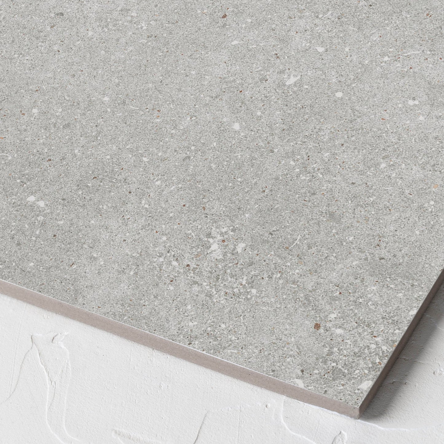 Corner close-up of the Serenity Urban Stone 300x300mm tile showing the matt surface and the edge profile