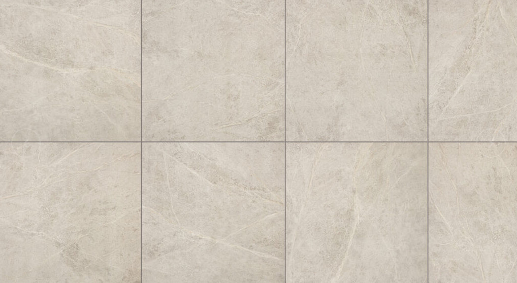 Soap Stone White External 600x600mm tiles arranged in a grid layout, showcasing a matte beige stone finish with natural veining and subtle texture variation.