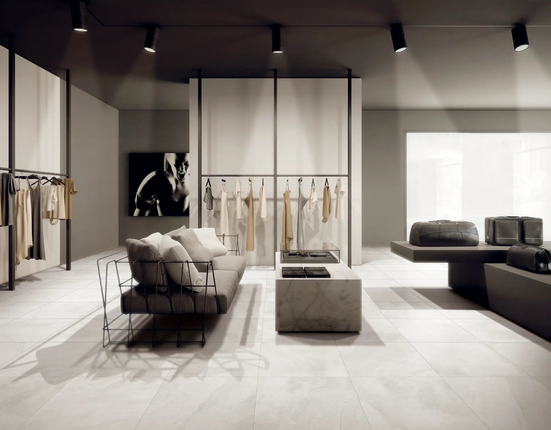 Stari White Matt Rectified 600x600mm tiles installed as a polished boutique floor, complementing a minimalist fashion retail space with marble coffee table and track lighting.