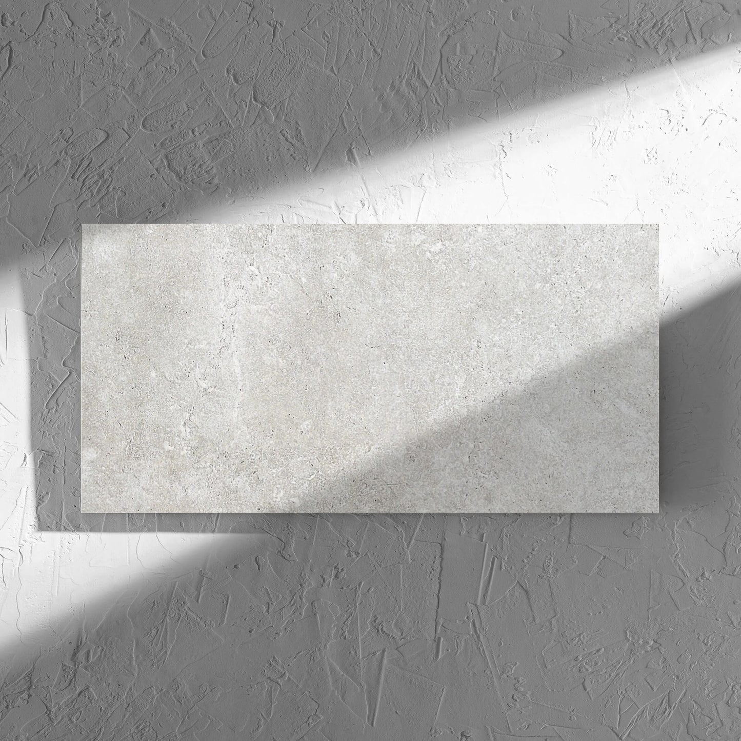 Stella Ash Matt 300x600mm tile in soft natural window light, showing the tile surface