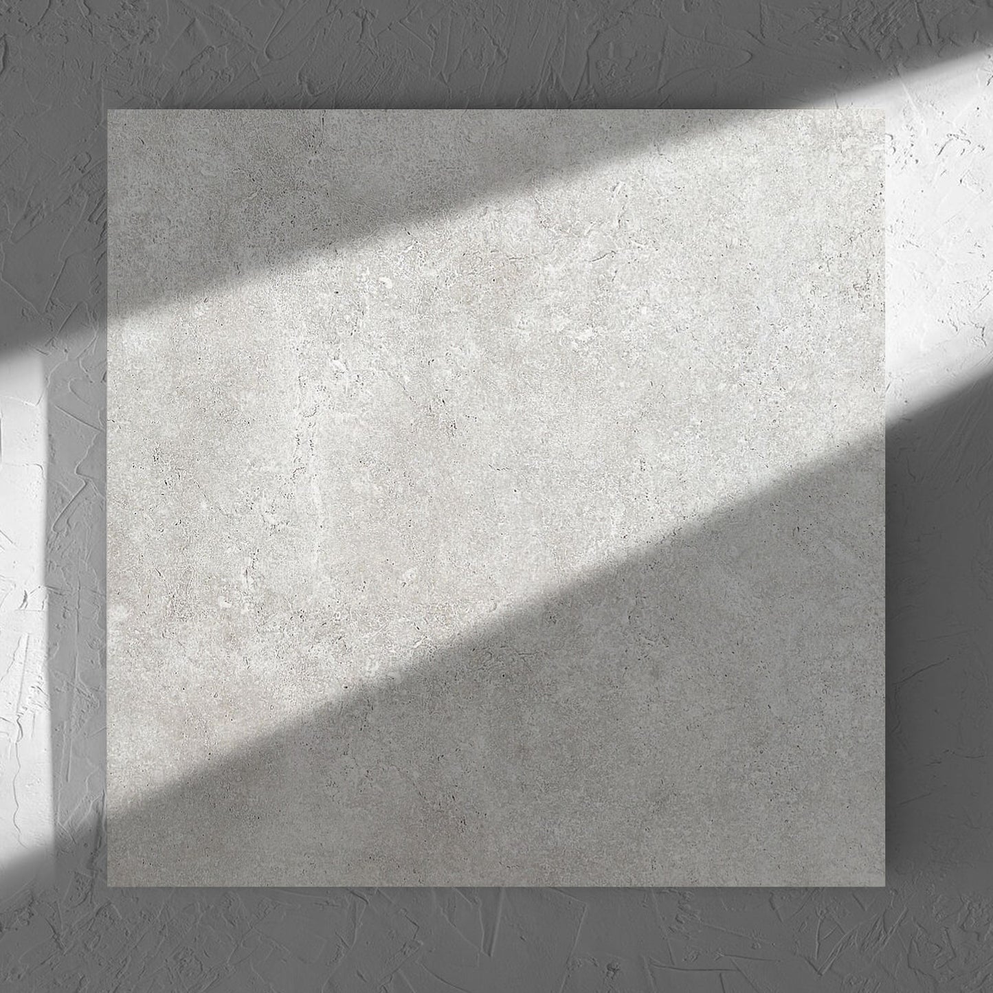 Stella Ash Matt 600x600mm tile in soft natural window light, showing the tile surface