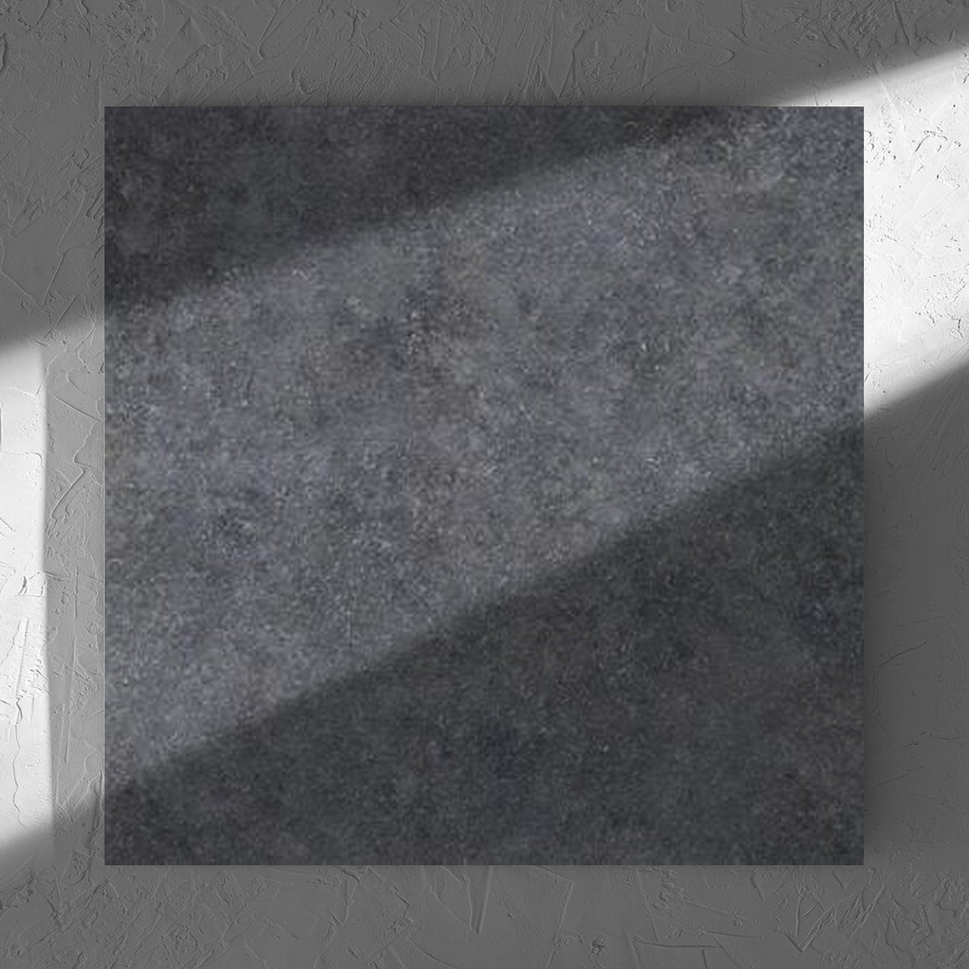 Stella Charcoal Lappato 600x600mm tile in soft natural window light, showing the lappato surface