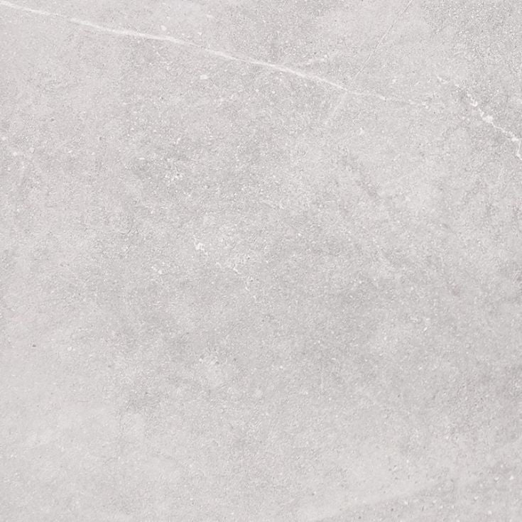 Close-up texture shot of T-Stone White 450x450mm porcelain tile showing a light grey stone-effect surface with subtle natural veining and matte finish.