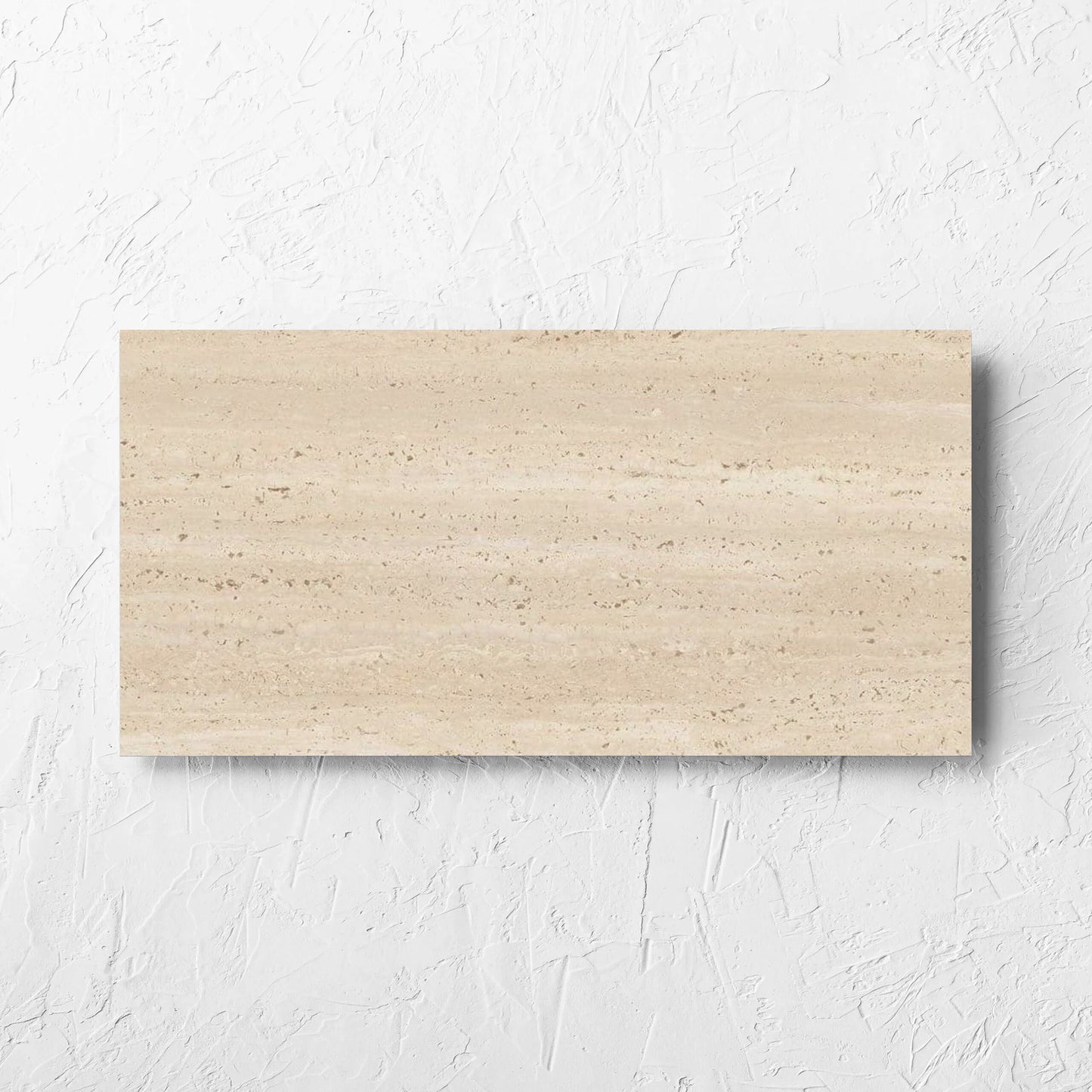 Tallow Vein Cut Travertine Look Beige 300x600mm tile laid flat on a white rendered wall, showing the tile surface