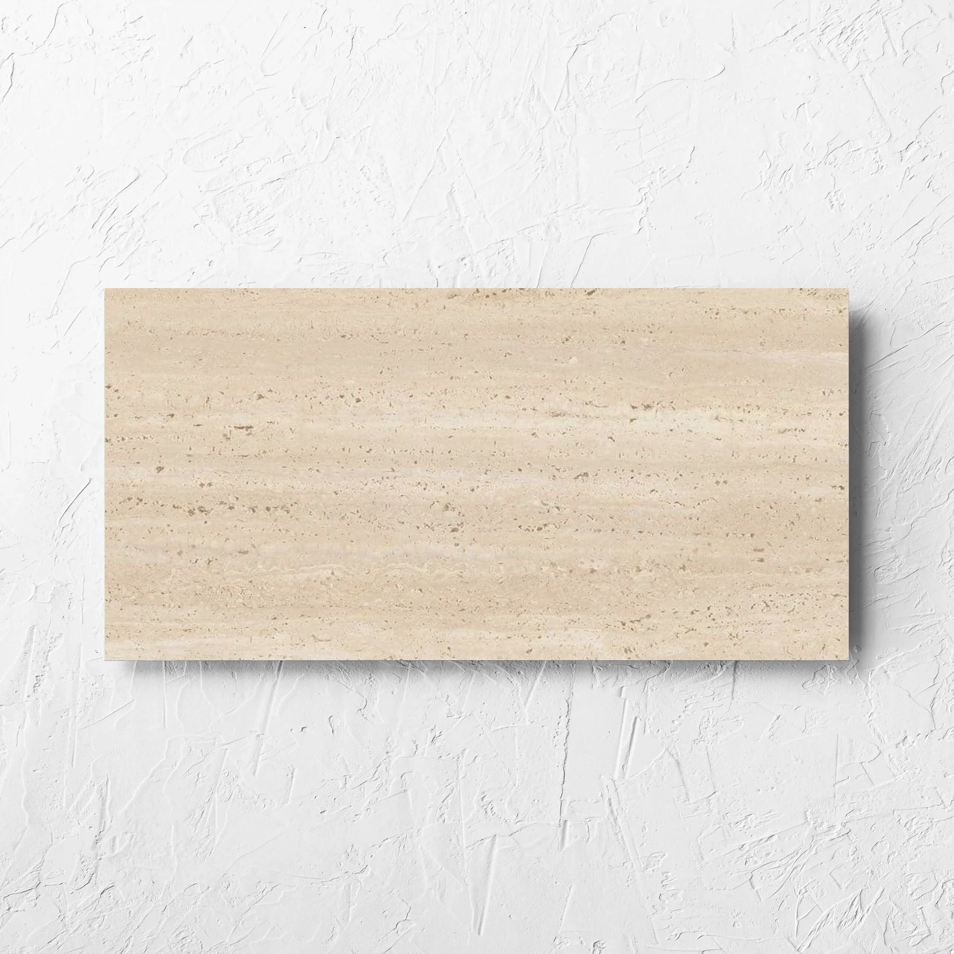 Tallow Vein Cut Travertine Look Beige 300x600mm tile laid flat on a white rendered wall, showing the tile surface