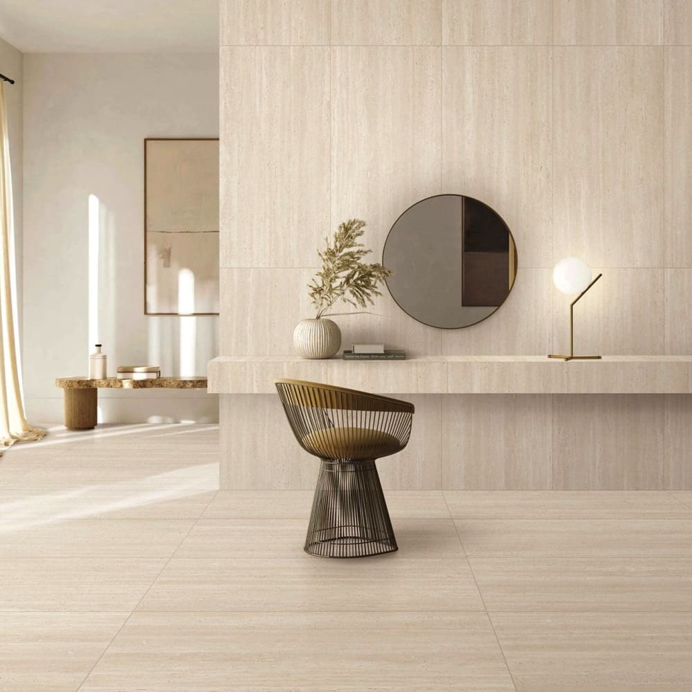 Tallow Vein Cut Travertine Look Beige travertine look tiles on a vanity lounge wall and floor with round mirror