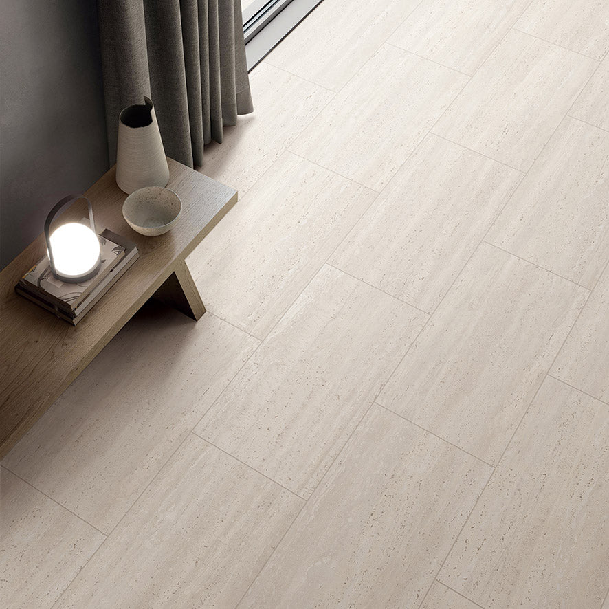 Tallow Vein Cut Travertine Look Ivory 300x600mm tiles brick-laid on a hallway floor