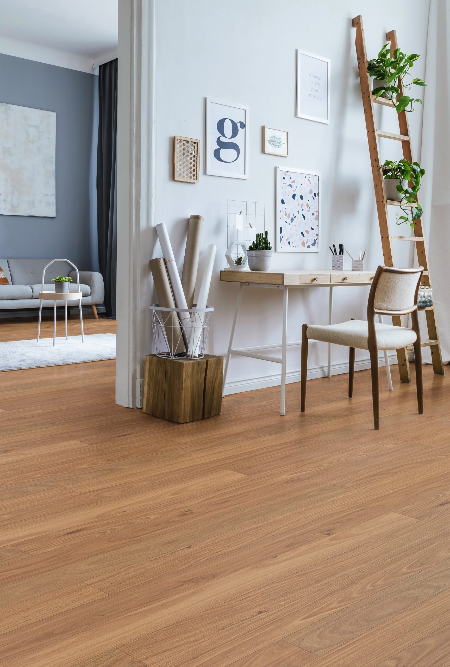 Tallowood Engineered Australian Classic Flooring 14/3mm installed in a bright Scandinavian-style home office with a timber desk, decorative ladder, and gallery wall.