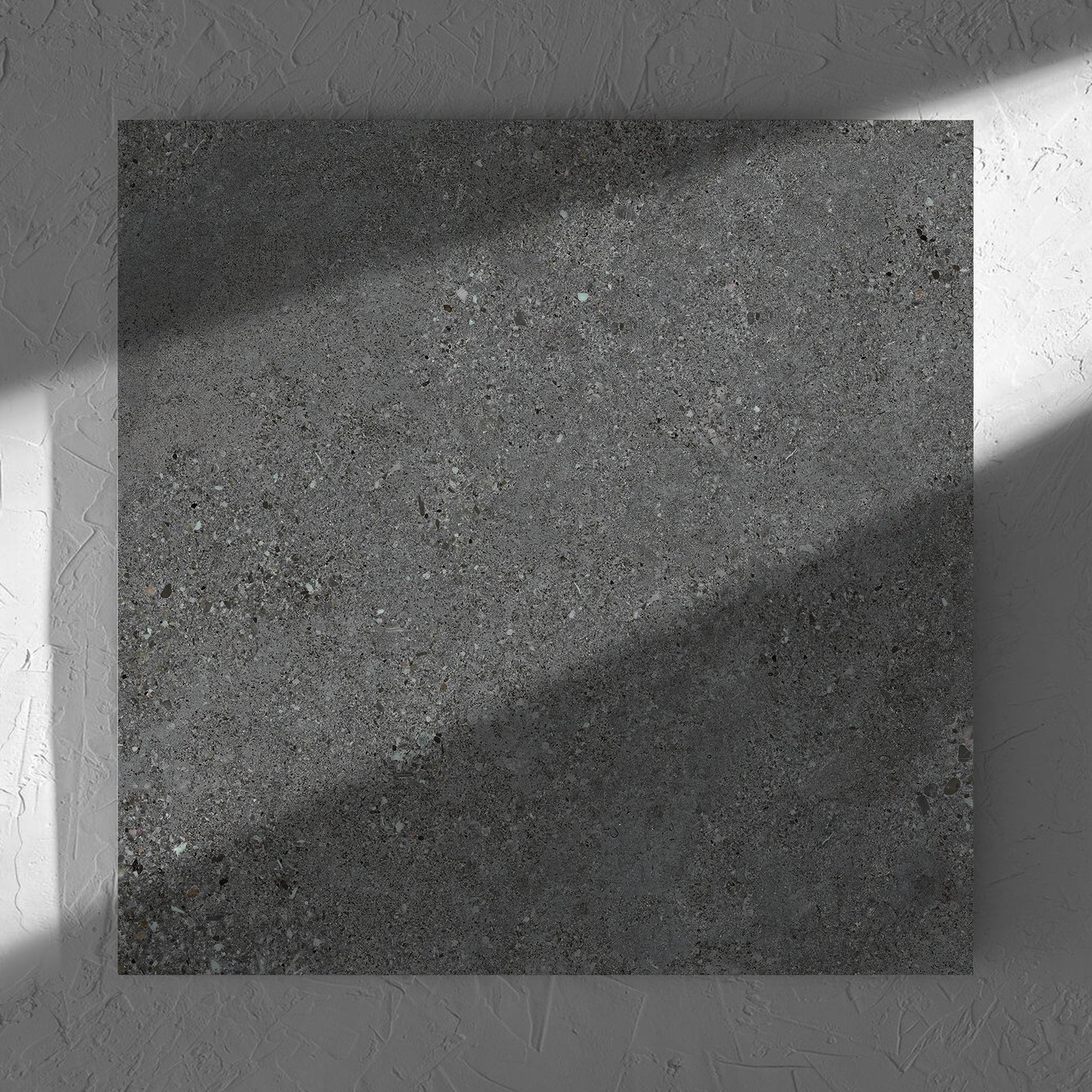 Terramix Charcoal Lappato 600x600mm tile in soft natural window light, showing the matt surface