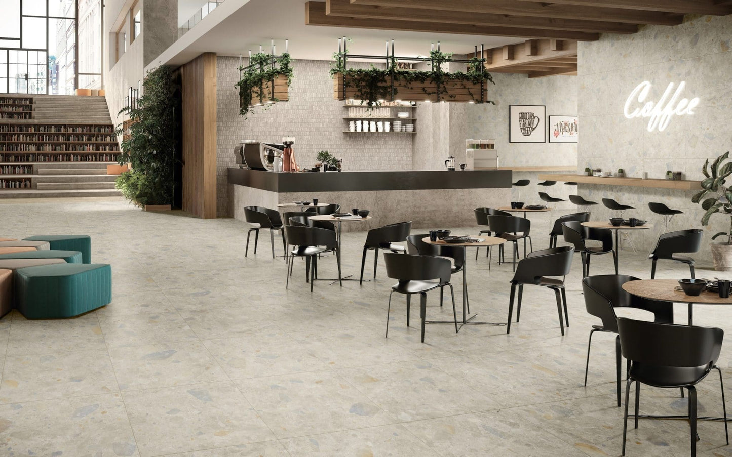 Terrazzo Rock Beige Matt 600x600mm floor tiles installed in a modern coffee shop with black chairs, wooden ceiling beams, and a barista counter.
